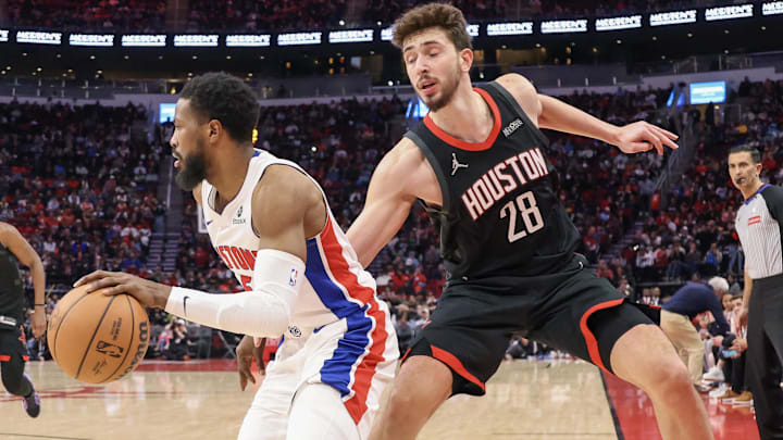 Detroit Pistons guard Malik Beasley (5) dribbles past Houston Rockets center Alperen Sengun (28) in the second half at Toyota Center. Mandatory Credit: Thomas Shea-Imagn Images