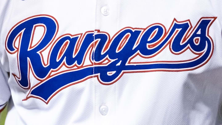 Texas Rangers logo on the front of a jersey.