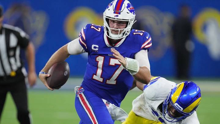 Buffalo Bills quarterback Josh Allen carries the ball against the Los Angeles Rams. Buffalo Bills quarterback Josh Allen carries the ball against the Los Angeles Rams.
