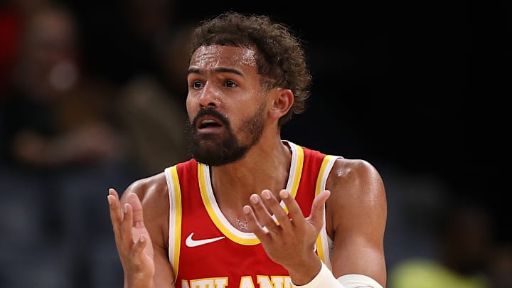 Trae Young raises his hands after a call against the Memphis Grizzlies