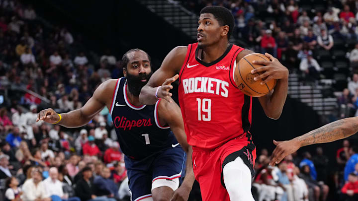 Houston Rockets guard Nate Williams (19) is defended by LA Clippers guard James Harden (1) and forward Derrick Jones Jr. (55) in the second half at the Intuit Dome.