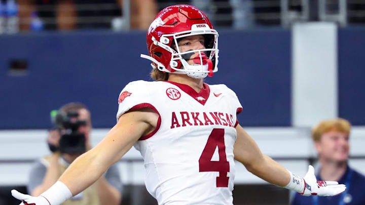 Sep 28, 2024; Arlington, Texas, USA;  Arkansas Razorbacks wide receiver Isaac TeSlaa (4) celebrates after scoring a touchdown during the first quarter against the Texas A&M Aggies at AT&T Stadium. Mandatory Credit: Kevin Jairaj-Imagn Images