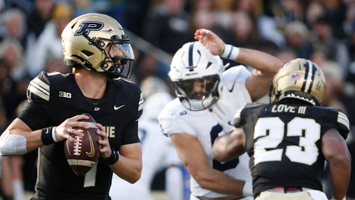 Purdue Boilermakers quarterback Hudson Card (1) goes to throw the ball Purdue Boilermakers quarterback Hudson Card (1) goes to throw the ball