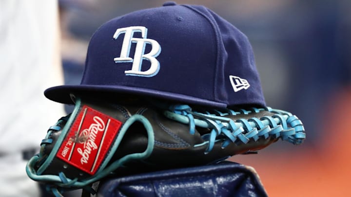 Sep 6, 2019; St. Petersburg, FL, USA; A detail view of a Tampa Bay Rays hat and glove at Tropicana Field.