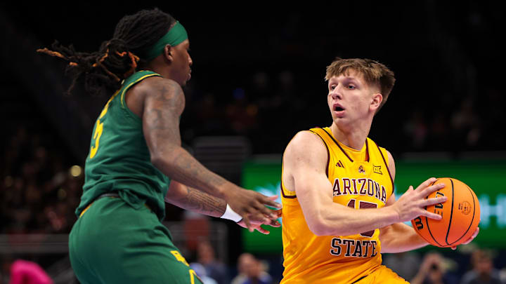 Mar 10, 2026; Kansas City, MO, USA; Arizona State Sun Devils guard Noah Meeusen (15) drives around Baylor Bears guard Obi Agbim (5) during the first half at T-Mobile Center. Mandatory Credit: William Purnell-Imagn Images