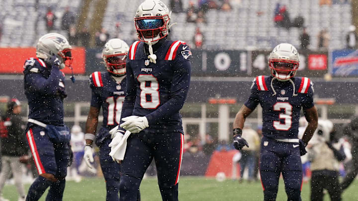New England Patriots WR Stefon Diggs and teammates warm up before the game against the Buffalo Bills.