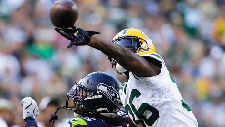 Green Bay Packers cornerback Kamal Hadden (36) breaks up a pass meant for Seattle Seahawks wide receiver Tyrone Broden.