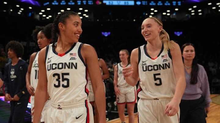 Connecticut Huskies guard Azzi Fudd (35) and Connecticut Huskies guard Paige Bueckers (5) celebrate after the game against the Louisville Cardinals at Barclays Center.