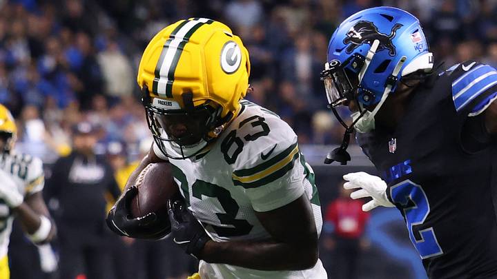 Green Bay Packers wide receiver Savion Williams (83) runs the ball against Detroit Lions cornerback Ennis Rakestraw Jr. Green Bay Packers wide receiver Savion Williams (83) runs the ball against Detroit Lions cornerback Ennis Rakestraw Jr.