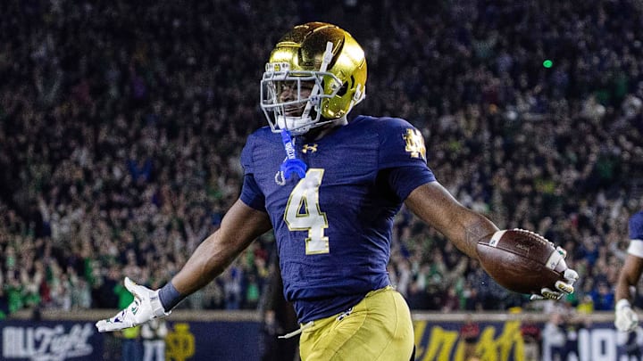 Notre Dame Fighting Irish running back Jeremiyah Love (4) celebrates a touchdown against the Southern California Trojans at Notre Dame Stadium. Notre Dame Fighting Irish running back Jeremiyah Love (4) celebrates a touchdown against the Southern California Trojans at Notre Dame Stadium.