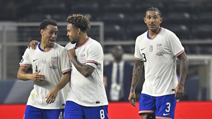 Mar 24, 2024; Arlington, Texas, USA; United States midfielder Tyler Adams (4) and midfielder Weston Mckennie (8) and defender Chris Richards (3) celebrates a goal scored by Adams against Mexico during the first half at AT&T Stadium. Mandatory Credit: Jerome Miron-Imagn Images
