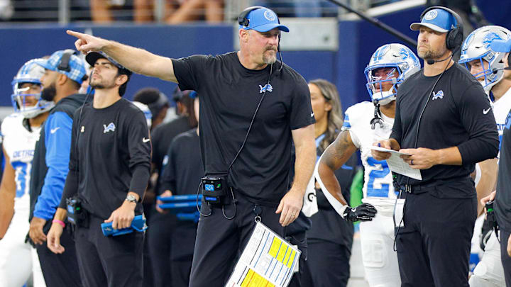 Detroit Lions Head Coach Dan Campbell talks with his coaches on the sideline Detroit Lions Head Coach Dan Campbell talks with his coaches on the sideline