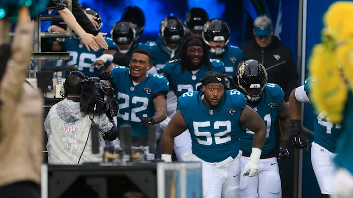 Jacksonville Jaguars defensive tackle DaVon Hamilton (52) leads the team onto the field before an NFL football matchup Sunday, Dec. 29, 2024 at EverBank Stadium in Jacksonville, Fla. The Jaguars held off the Titans 20-13. [Corey Perrine/Florida Times-Union]