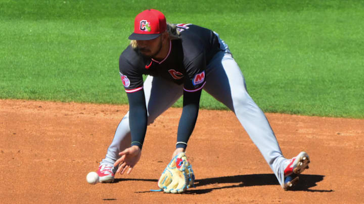 Feb 27, 2026; Mesa, Arizona, USA; Cleveland Guardians shortstop Gabriel Arias (13) fields a ball as part of a double play in the third inning against the Chicago Cubs at Sloan Park. Mandatory Credit: Matt Kartozian-Imagn Images
