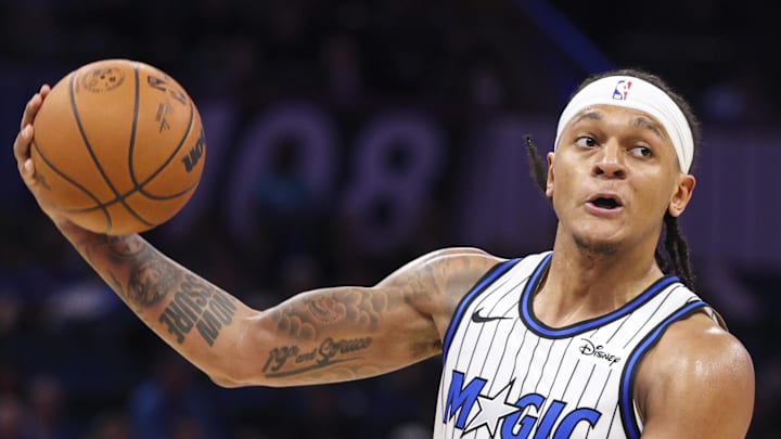 Orlando Magic forward Paolo Banchero passes the ball against the Portland Trail Blazers. Orlando Magic forward Paolo Banchero passes the ball against the Portland Trail Blazers.