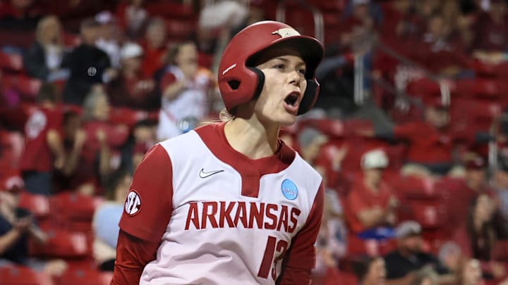 May 18, 2025; Fayetteville, AR, USA; Arkansas Razorbacks pinch runner Kasey Wood (13) celebrates after scoring during the game against the Oklahoma State Cowgirls at Bogle Park. Mandatory Credit: Nelson Chenault-Imagn Images