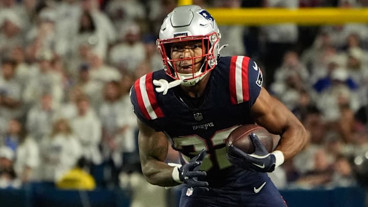 Oct 5, 2025; Orchard Park, New York, USA; New England Patriots running back Treveyon Henderson (32) runs with the ball against the Buffalo Bills during the second half at Highmark Stadium. Oct 5, 2025; Orchard Park, New York, USA; New England Patriots running back Treveyon Henderson (32) runs with the ball against the Buffalo Bills during the second half at Highmark Stadium.