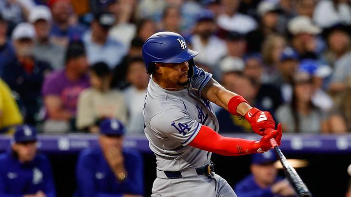 Los Angeles Dodgers second baseman Santiago Espinal (21) hits a single