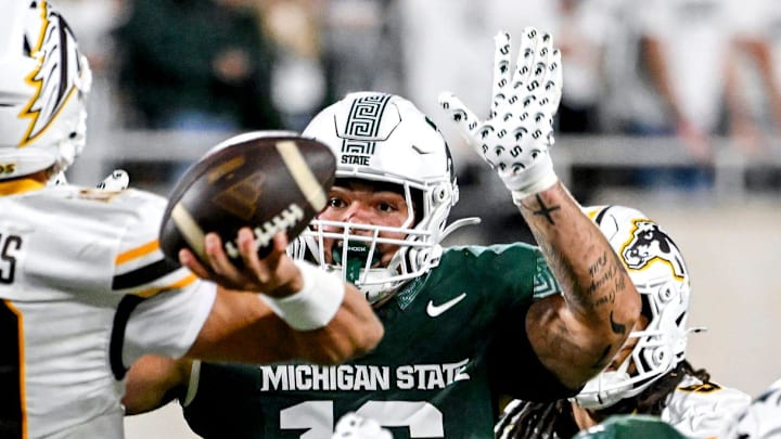 Michigan State's Grady Kelly, right, pressures Western Michigan's Brady Jones, left, during the fourth quarter on Friday, Aug. 29, 2025, in East Lansing. Michigan State's Grady Kelly, right, pressures Western Michigan's Brady Jones, left, during the fourth quarter on Friday, Aug. 29, 2025, in East Lansing.