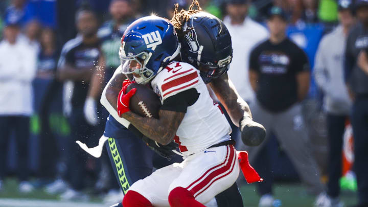 Oct 6, 2024; Seattle, Washington, USA; Seattle Seahawks safety Rayshawn Jenkins (2) tackles New York Giants wide receiver Wan’Dale Robinson (17) following a reception by Robinson during the second quarter at Lumen Field. Mandatory Credit: Joe Nicholson-Imagn Images