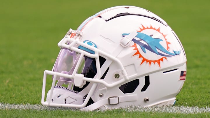 Jul 27, 2022; Miami Gardens, FL, USA; A general view of a Miami Dolphins helmet on the field during training camp at Baptist Health Training Complex. Mandatory Credit: Jasen Vinlove-Imagn Images