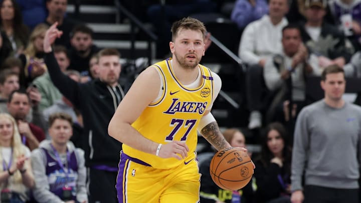 Feb 12, 2025; Salt Lake City, Utah, USA;  Los Angeles Lakers guard Luka Doncic (77) dribbles during the second quarter against the Utah Jazz at Delta Center. Mandatory Credit: Chris Nicoll-Imagn Images