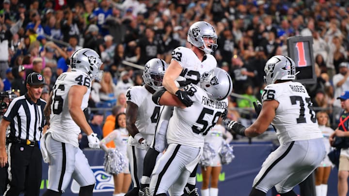 Aug 7, 2025; Seattle, Washington, USA; Las Vegas Raiders center Jackson Powers-Johnson (58) celebrates with running back Dylan Laube (23) after Laube scored a touchdown against the Seattle Seahawks during the second half at Lumen Field. Mandatory Credit: Steven Bisig-Imagn Images Aug 7, 2025; Seattle, Washington, USA; Las Vegas Raiders center Jackson Powers-Johnson (58) celebrates with running back Dylan Laube (23) after Laube scored a touchdown against the Seattle Seahawks during the second half at Lumen Field. Mandatory Credit: Steven Bisig-Imagn Images