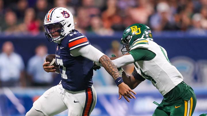 Sep 5, 2026; Atlanta, Georgia, USA; Auburn Tigers quarterback Byrum Brown (17) scrambles past Baylor Bears safety Daniel Cobbs (14) in the fourth quarter at Mercedes-Benz Stadium. Mandatory Credit: Brett Davis-Imagn Images Sep 5, 2026; Atlanta, Georgia, USA; Auburn Tigers quarterback Byrum Brown (17) scrambles past Baylor Bears safety Daniel Cobbs (14) in the fourth quarter at Mercedes-Benz Stadium. Mandatory Credit: Brett Davis-Imagn Images