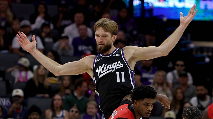 Oct 23, 2026; Sacramento, California, USA;  Sacramento Kings forward-center Domantas Sabonis (11) is fouled by Portland Trail Blazers guard Scoot Henderson (00) during the second quarter at Golden 1 Center.  Mandatory Credit: Dennis Lee-Imagn Images