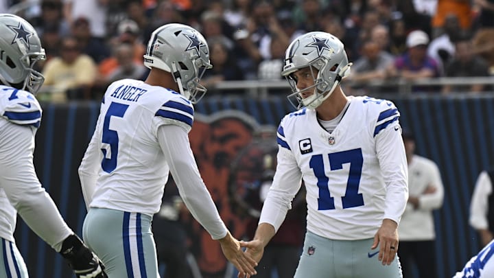 Dallas Cowboys kicker Brandon Aubrey high-fives punter Bryan Anger after scoring during the first half at Soldier Field. Dallas Cowboys kicker Brandon Aubrey high-fives punter Bryan Anger after scoring during the first half at Soldier Field.