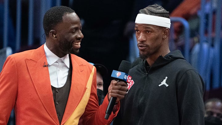 February 20, 2022; Cleveland, Ohio, USA; Team Durant forward Draymond Green of the Golden State Warriors (23, left) interviews Team LeBron forward Jimmy Butler of the Miami Heat (22) during the fourth quarter in the 2022 NBA All-Star Game at Rocket Mortgage FieldHouse. Mandatory Credit: Kyle Terada-Imagn Images