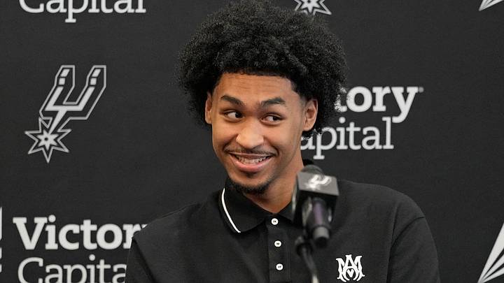 Jun 28, 2025; San Antonio, TX, USA; San Antonio first round draft pick Dylan Harper (2) reacts to a question from the media during a press conference at Victory Capital Performance Center. Mandatory Credit: Scott Wachter-Imagn Images