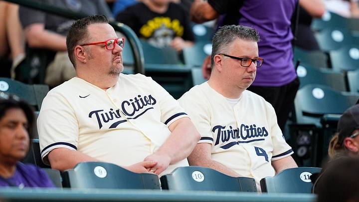 Jul 19, 2025; Denver, Colorado, USA; Minnesota Twins fans following a rain delay against the Colorado Rockies at Coors Field. Mandatory Credit: Ron Chenoy-Imagn Images