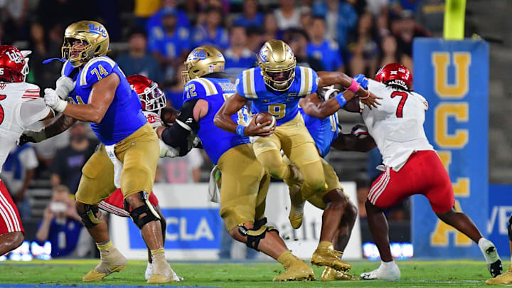 Aug 30, 2025; Pasadena, California, USA; UCLA Bruins quarterback Nico Iamaleava (9) runs the ball against the Utah Utes during the first half at Rose Bowl. Mandatory Credit: Gary A. Vasquez-Imagn Images