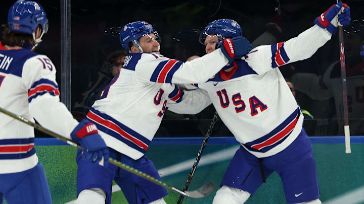 [US, Mexico & Canada customers only] Feb 12, 2026; Milan, Italy;  Brady Tkachuk of United States celebrates scoring their first goal with Matthew Tkachuk of United States and teammates against Latvia in men's ice hockey group C play during the Milano Cortina 2026 Olympic Winter Games at Milano Santagiulia Ice Hockey Arena. Mandatory Credit: Mike Segar/Reuters via Imagn Images