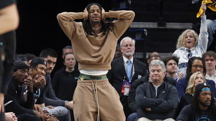 Jan 31, 2026; Memphis, Tennessee, USA; Memphis Grizzlies guard Ja Morant (12) reacts during the fourth quarter against the Minnesota Timberwolves at FedExForum. Mandatory Credit: Petre Thomas-Imagn Images
