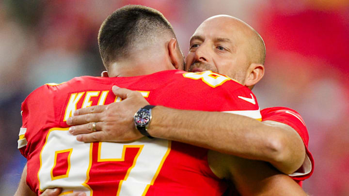 Oct 12, 2025; Kansas City, Missouri, USA; Kansas City Chiefs offensive coordinator Matt Nagy hugs tight end Travis Kelce (87) prior to a game against the Detroit Lions at GEHA Field at Arrowhead Stadium. Mandatory Credit: Jay Biggerstaff-Imagn Images