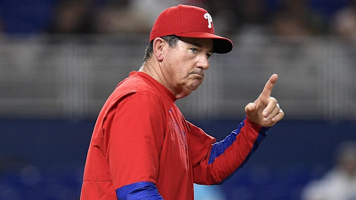 Jun 17, 2025; Miami, Florida, USA;  Philadelphia Phillies manager Rob Thomson signals for pitcher Tanner Banks during the 6th inning against the Miami Marlins at loanDepot Park