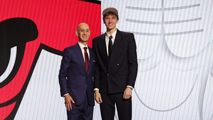 Jun 26, 2024; Brooklyn, NY, USA; Matas Buzelis poses for photos with NBA commissioner Adam Silver after being selected in the first round by the Chicago Bulls in the 2024 NBA Draft at Barclays Center. Mandatory Credit: Brad Penner-Imagn Images