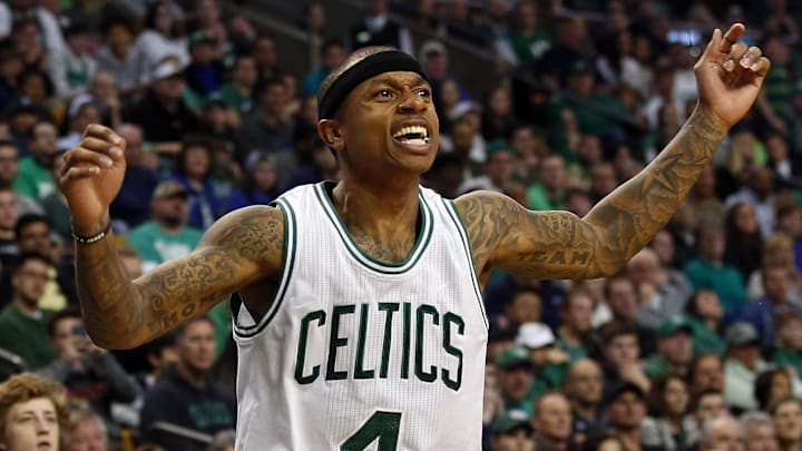 Mar 26, 2017; Boston, MA, USA; Fans and Boston Celtics guard Isaiah Thomas (4) reacts on the court during the second half of the Boston Celtics 112-108 win over the Miami Heat at TD Garden. Mandatory Credit: Winslow Townson-Imagn Images