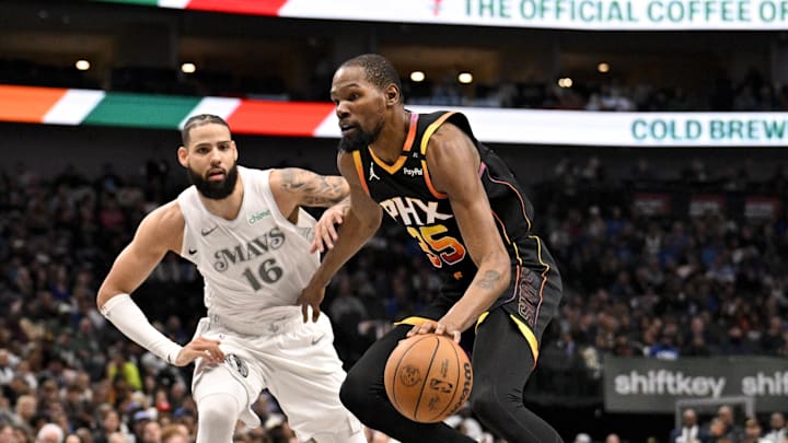 Mar 9, 2025; Dallas, Texas, USA; Phoenix Suns forward Kevin Durant (35) drives to the basket past Dallas Mavericks forward Caleb Martin (16) during the second quarter at the American Airlines Center. Mandatory Credit: Jerome Miron-Imagn Images