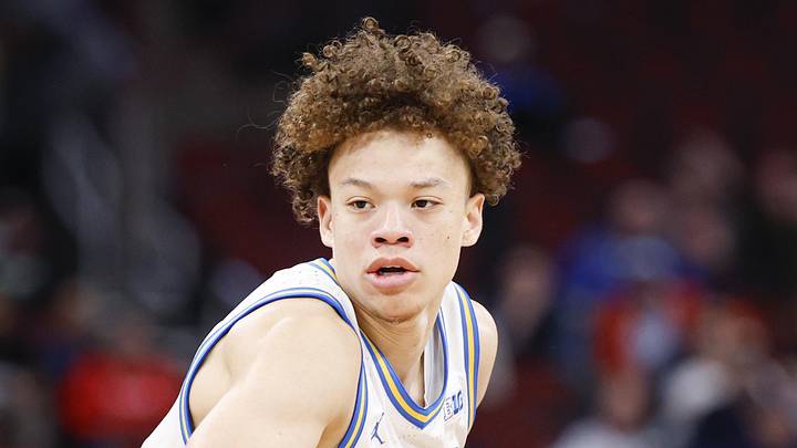 Mar 12, 2026; Chicago, IL, USA; UCLA Bruins guard Trent Perry (0) brings the ball up court against the Rutgers Scarlet Knights during the second half at United Center. Mandatory Credit: Kamil Krzaczynski-Imagn Images