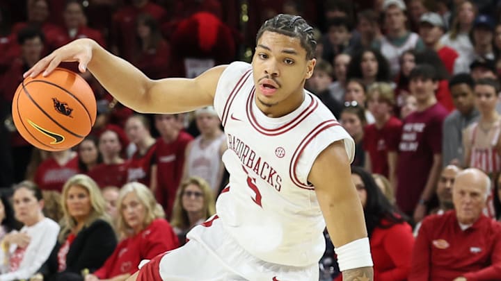 Arkansas Razorbacks guard Darius Acuff Jr (5) dribbles during the first half against the Auburn Tigers at Bud Walton Arena.