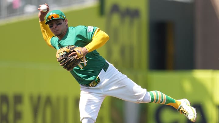 Apr 12, 2025; West Sacramento, California, USA; Athletics third baseman Luis Urias (17) throws the ball to first to record an out against the New York Mets in the fifth inning at Sutter Health Park.