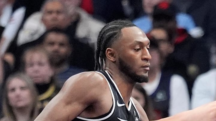 Miami Heat forward Jaime Jaquez Jr. drives to the basket against Toronto Raptors guard Immanuel Quickley.