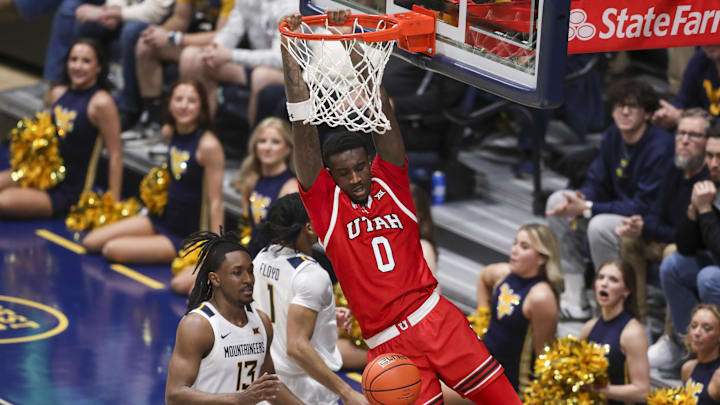 Feb 18, 2026; Morgantown, West Virginia, USA; Utah Utes forward Seydou Traore (0) dunks the ball during the second half against the West Virginia Mountaineers at Hope Coliseum. Mandatory Credit: Ben Queen-Imagn Images