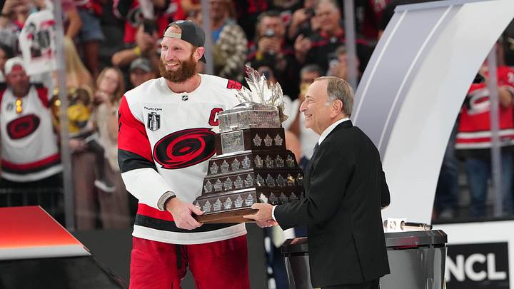 Jun 14, 2026; Las Vegas, Nevada, USA; Carolina Hurricanes center Jordan Staal (11) is awarded the the Conn Smythe Trophy by Commisioner of the NHL Gary Bettman after defeating the Vegas Golden Knights in game six of the 2026 Stanley Cup Final at T-Mobile Arena. Mandatory Credit: Stephen R. Sylvanie-Imagn Images