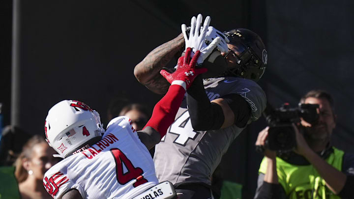 Colorado Buffaloes wide receiver Will Sheppard (14) pulls in a touchdown over Utah cornerback Cameron Calhoun.