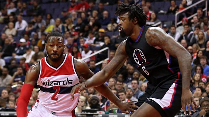 Dec 18, 2016; Washington, DC, USA; Washington Wizards guard John Wall (2) dribbles the ball as LA Clippers center DeAndre Jordan (6) defends in the third quarter at Verizon Center. The Wizards won 117-110. Mandatory Credit: Geoff Burke-Imagn Images
