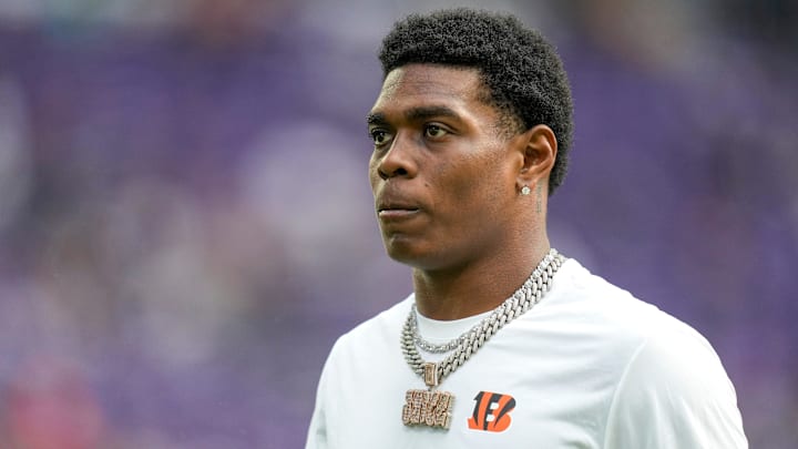 Injured Cincinnati Bengals cornerback Cam Taylor-Britt (29) walks the field during warmups before the first quarter of the NFL Week 3 game between the Minnesota Vikings and the Cincinnati Bengals at U.S. Bank Stadium in Minneapolis on Sunday, Sept. 21, 2025.